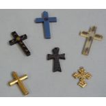 Six various crucifix in gilt metal, plastic, compressed wood, black glass etc,