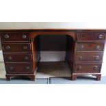 A late 19th/early 20th century mahogany kneehole desk,