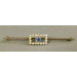 An Art Deco sapphire and seed pearl bar brooch in 15ct gold,