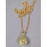 A citrine pendant and chain in 9ct gold,