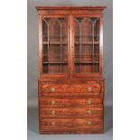 A George IV figured mahogany secretaire-bookcase,