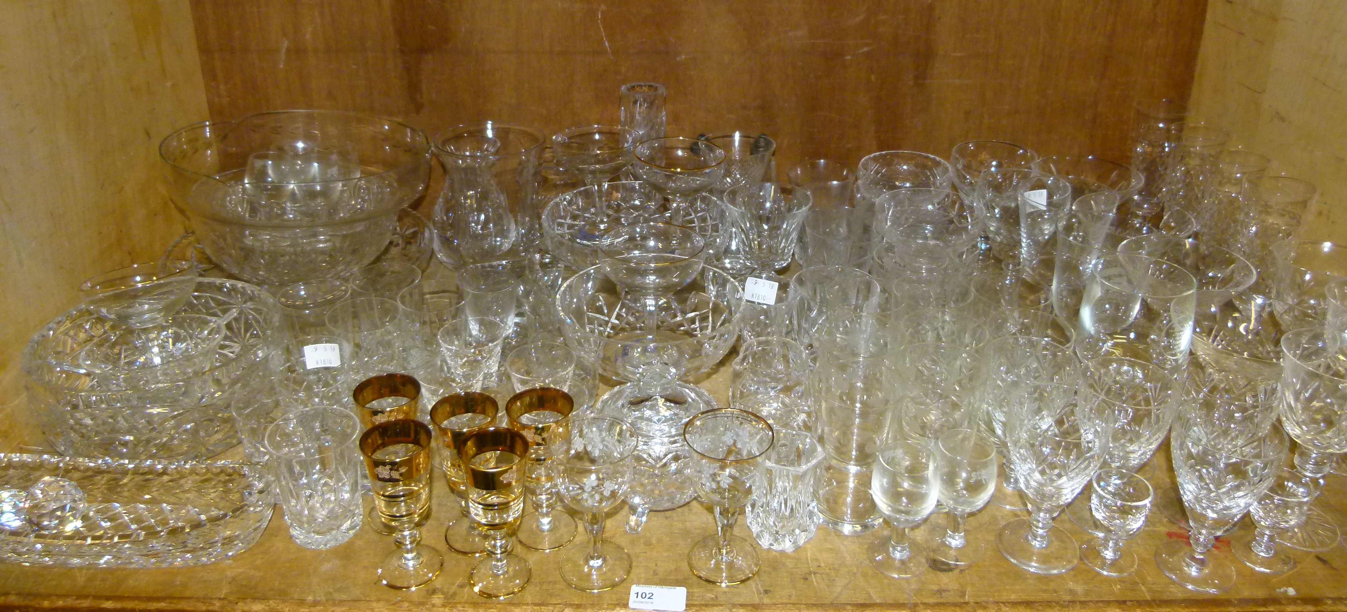 A large quantity of miscellaneous cut and other glass ware including wines, champagnes,