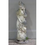 A concrete garden figure of a young woman, circular base,