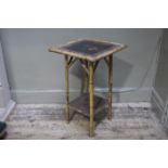 A Victorian bamboo and lacquered occasional table with undertier