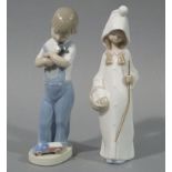 Two Lladro figures, one a young boy holding a hammer in his right hand a lorry at his feet,