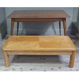 A teak extending dining table on turned, tapered, splayed legs,