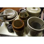 Stoneware jars, pestle and mortar, salt glaze bowl, tin ladle and an iron weight,