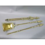 A set of three reproduction brass fire implements comprising, shovel, tongs and poker,