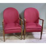 Two beech framed tub chairs upholstered in red fabric, swept arms on turned supports,