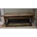 An oak rectangular coffee table on turned and square framing