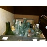 A quantity of vintage saltglazed and glass bottles