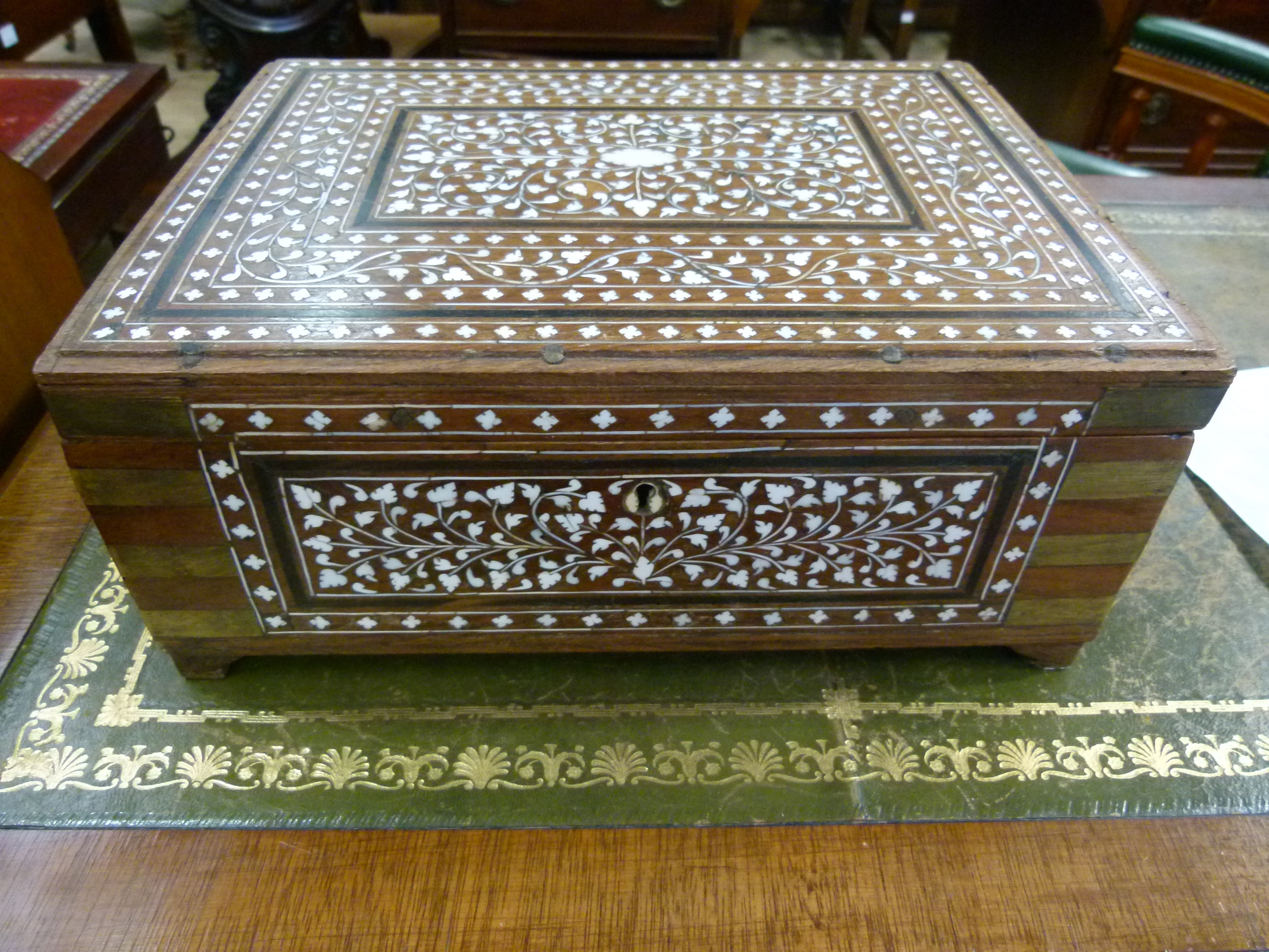 A bone inlaid hardwood Eastern box with brass bound corners the hinged lid with central mirror