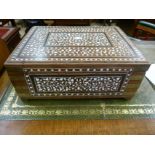 A bone inlaid hardwood Eastern box with brass bound corners the hinged lid with central mirror