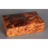 A 19th century tortoiseshell trinket box, rectangular, having a domed lid and paper lined interior,