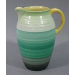 A Shelley pottery baluster jug the body graded from black to pale green with yellow loop handle,