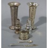 A pair of panelled silver tapered cylindrical spill vases, a silver napkin ring,