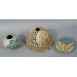 A Bernard Rooke pottery wall pocket relief moulded with a butterfly and reeds, 18cm high,