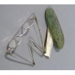 A green shagreen spectacle case of tapered oval form, containing a pair of spectacles, case 13.