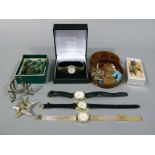 A shoe box containing a small collection of costume jewellery,