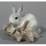 A Lladro porcelain figure of a rabbit and branch, 10cm wide approx,