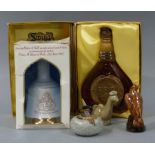 A Scotch whisky miniature curling stone bottle, a Beneagles Beswick potter eagle decanter,