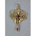 An Edward VII garnet and seed pearl Art Nouveau pendant in 9ct gold,