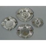 Four various silver ashtrays, various sizes, dates and makers, 12cm diameter and smaller,