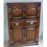 A reproduction oak drinks cabinet in late 17th century style,