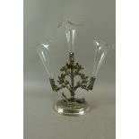 A late Victorian silver plated centre piece with three clear trumpet shaped vases the stem cast