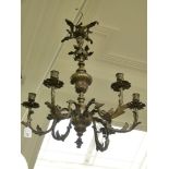 An 18th/19th century six-light chandelier, cast with foliate arms,