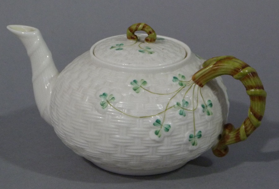 A Belleek basket weave compressed globular teapot decorated with clover leaves, - Image 2 of 2