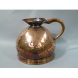 A Victorian four gallon copper measure with loop handle,