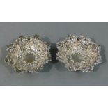 A pair of white metal sweetmeat dishes (tests as silver), embossed with shells, scrolls,