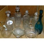 Four cut and pressed glass decanters,