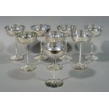 A set of eight silver plated champagnes, 16.