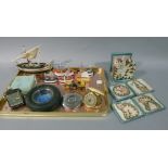A chromium plated flying saucer cigarette lighter, two travelling alarm clocks, a Goodyear ash tray,