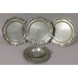 A set of three 19th century pewter plates with London touchmarks, piecrust rims, maker B & P, 22.