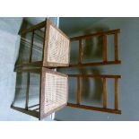 A pair of oak framed bedroom chairs with caned seats