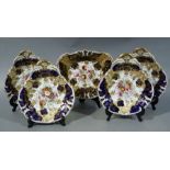 An English porcelain five piece dessert service comprising four single handled shaped dishes and a