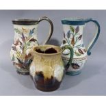 Two Denby baluster jugs each decorated with stylised leaves, loop handles,