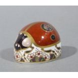 A Royal Crown Derby paperweight modelled as a ladybird, gilt plug,
