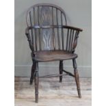 A 19th century low back Windsor armchair on turned framing