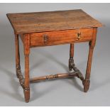 An 18th century fruitwood side table having a planked top,