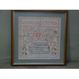 A Victorian sampler by Mary Folder worked with alphabet within geometric border,