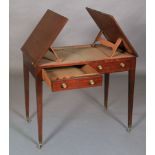 A George VI mahogany architect's table, having twin lift up top on adjustable ratchets,