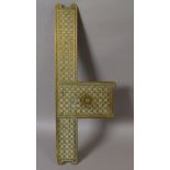 A 19th century Middle Eastern brass door plate, 'L' shaped,