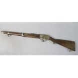 A Martini action Enfield rifle bearing proof stamps numbered 2 and with brass RIC/6458 inlaid