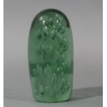 A Victorian green glass dump or paperweight, internally decorated with rising bubbles,