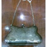 A silver plated purse with suspension chain,