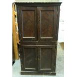 A Victorian scrumbled pine four door cupboard on plinth base (cut sides)